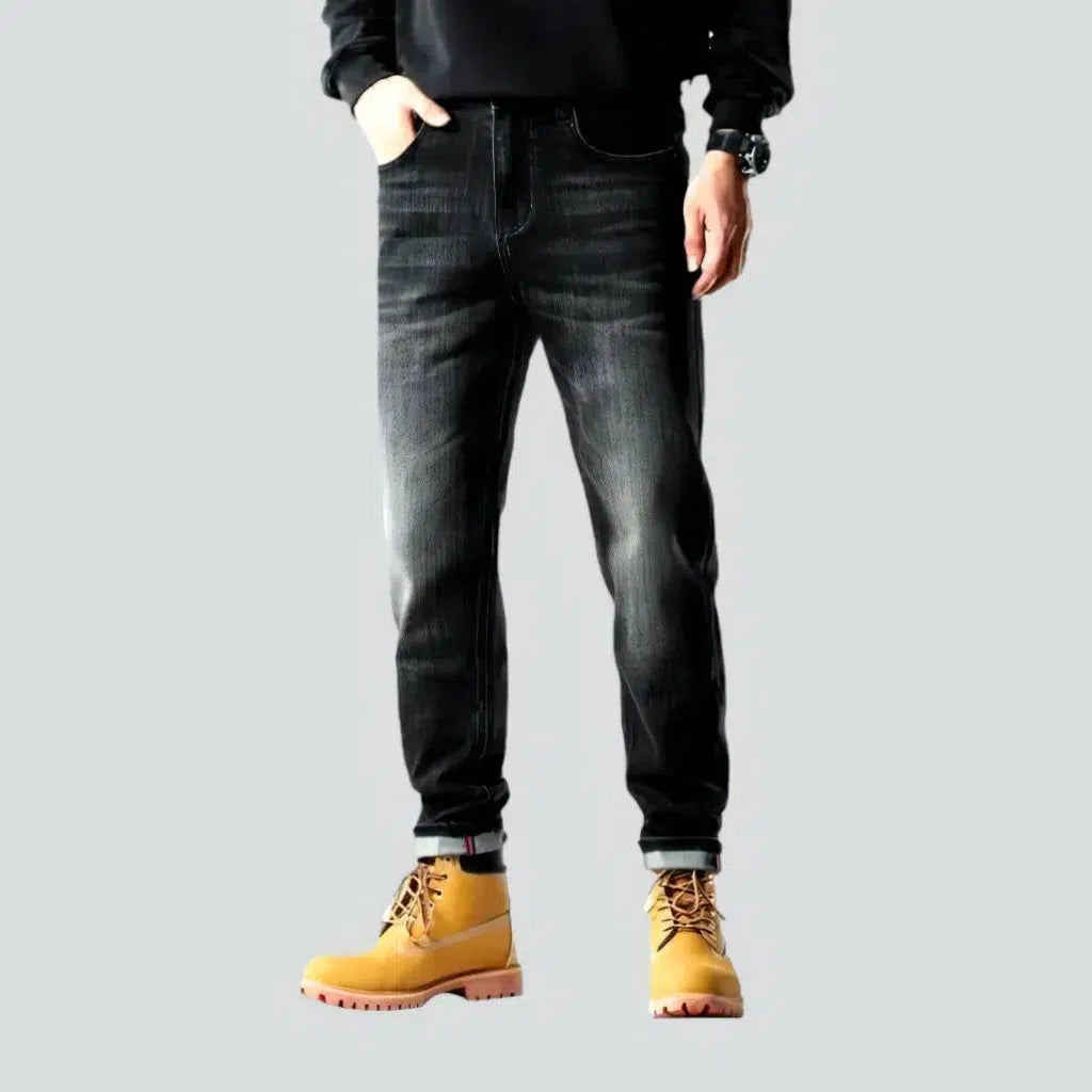 Whiskered men's tapered jeans